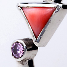Heavy silver with triangular coral cubic zirconia in an 'open' style ring 