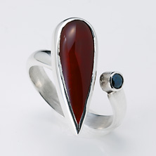 Teardrop carnelian stone with black cubic zirconia set in an 'open' style ring 