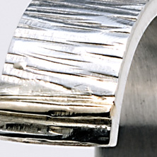 Textured ring in 'open' style with gold detail 