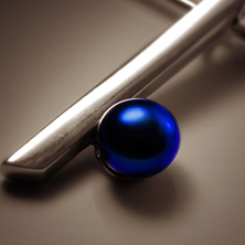 Silver bar pendant with black pearl worn on a silver wire 