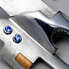 'Town piece' silver pendant in the style of a town house with gold detail and set stones 