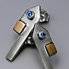 'Town piece' silver pendant in the style of a town house with gold detail and set stones 