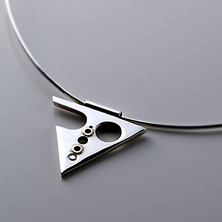 Triangular style pendant with gold design and flush set cubic zirconia 