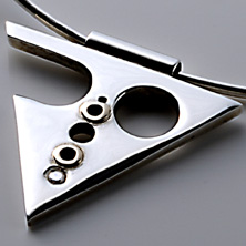 Triangular style pendant with gold design and flush set cubic zirconia 