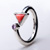 Heavy silver with triangular coral cubic zirconia in an 'open' style ring 