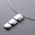 Graduated squares with smaller textured squares worn on a silver wire
