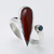 Teardrop carnelian stone with black cubic zirconia set in an 'open' style ring 