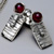 Silver and garnet set in a raised section of square wire view 4